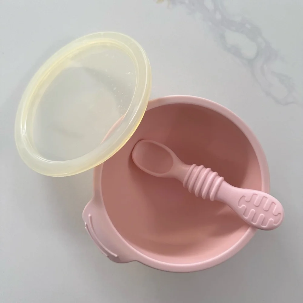 Three Silicone Baby Plates and one Pink Bib